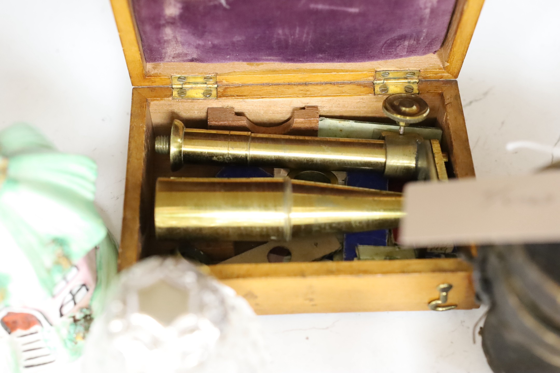 A Victorian silver topped bottle and box, silver spoon, enamel topped box, opera glasses, a portable microscope etc